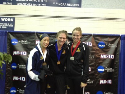Caitlin Brauer (center) is considered the greatest female swimmer Saint Rose has ever put in the water