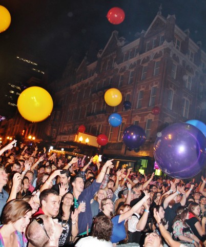 Giant purple, yellow, red, and blue balloons fall during Portugal. The Man’s encore of their song “Purple Yellow Red and Blue." Photo credit: Lauren Halligan