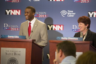 Corey Ellis and Kathy Sheehan laugh as they answered questions during the Mayoral debate on Tuesday. Photo by Jackson Wang.
