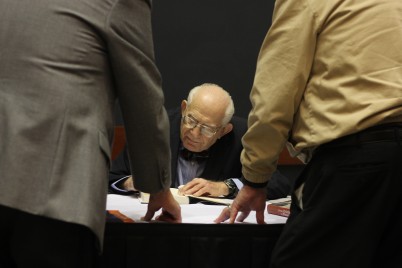 Harry Rosenfeld signing his new book From Kristallnact to Watergate: Memoirs of a Newspaper Man on Monday night. (Photo Credit: Kelly Pfeister)
