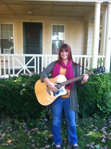Laura Coyle in front of her home on South Main Avenue in the Pine Hills. (Photo Credit: STEPHANIE MONTGOMERY)