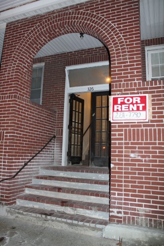 A For Rent sign was placed in front of the building on Wednesday (Photo Credit: Lauren Halligan) 