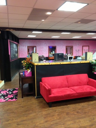Curl Up ‘n’ Dye’s pink and black color scheme gives the salon both  a fun and edgy look (Santanya Sharpe).